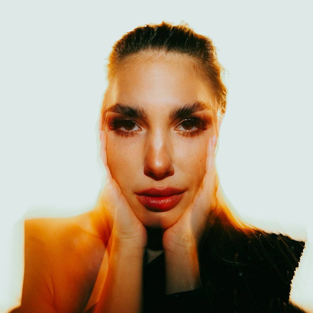 A woman with her hands on her face