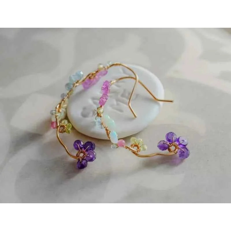 A variety of gemstone flower hoop earrings, pink sapphires, blue topaz, exquisite handcrafted gifts