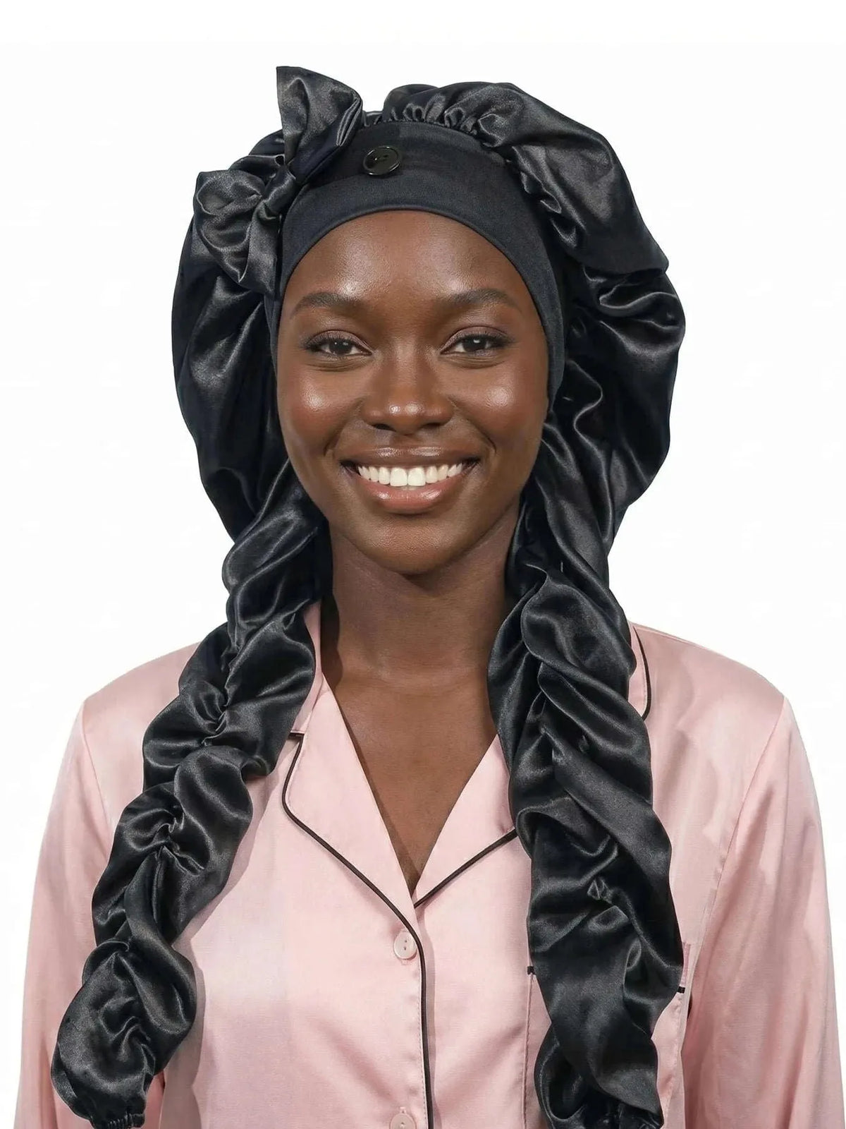 Black satin sleep bonnet with gathered crown and long curling ribbons