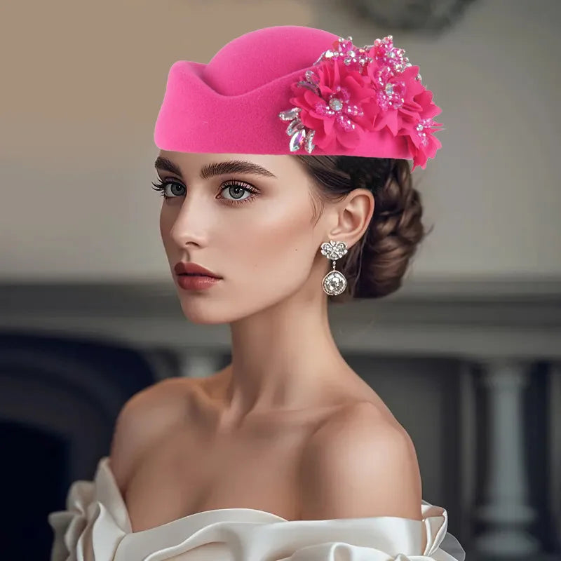 Bright pink African headtie turban hat adorned with flowers and embellishments, suitable for summer and autumn occasions.