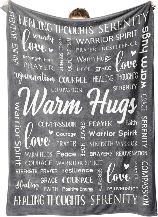 Warm Hugs healing blanket, gray with white faith-themed words and “Warm Hugs” script