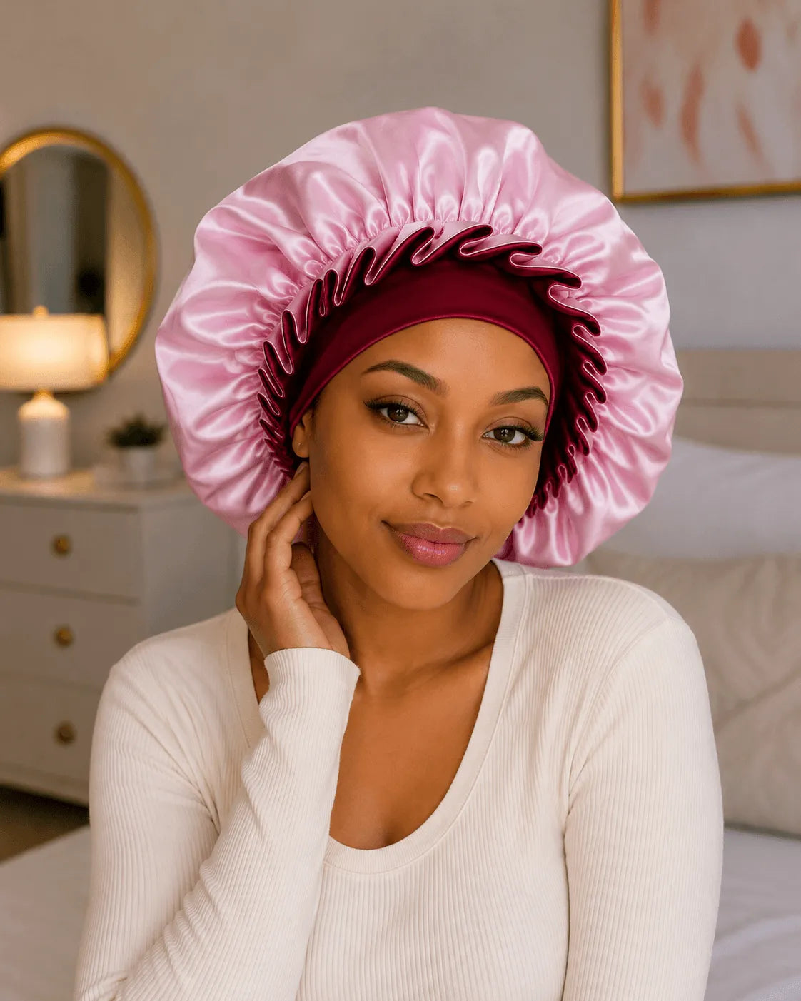 Pink satin sleep hat with ruched bonnet edge and wavy trim, women’s hair cap