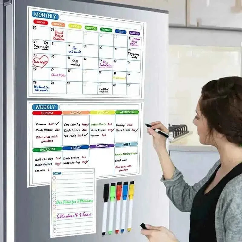 Magnetic monthly and weekly dry-erase planner on a fridge with colored pens
