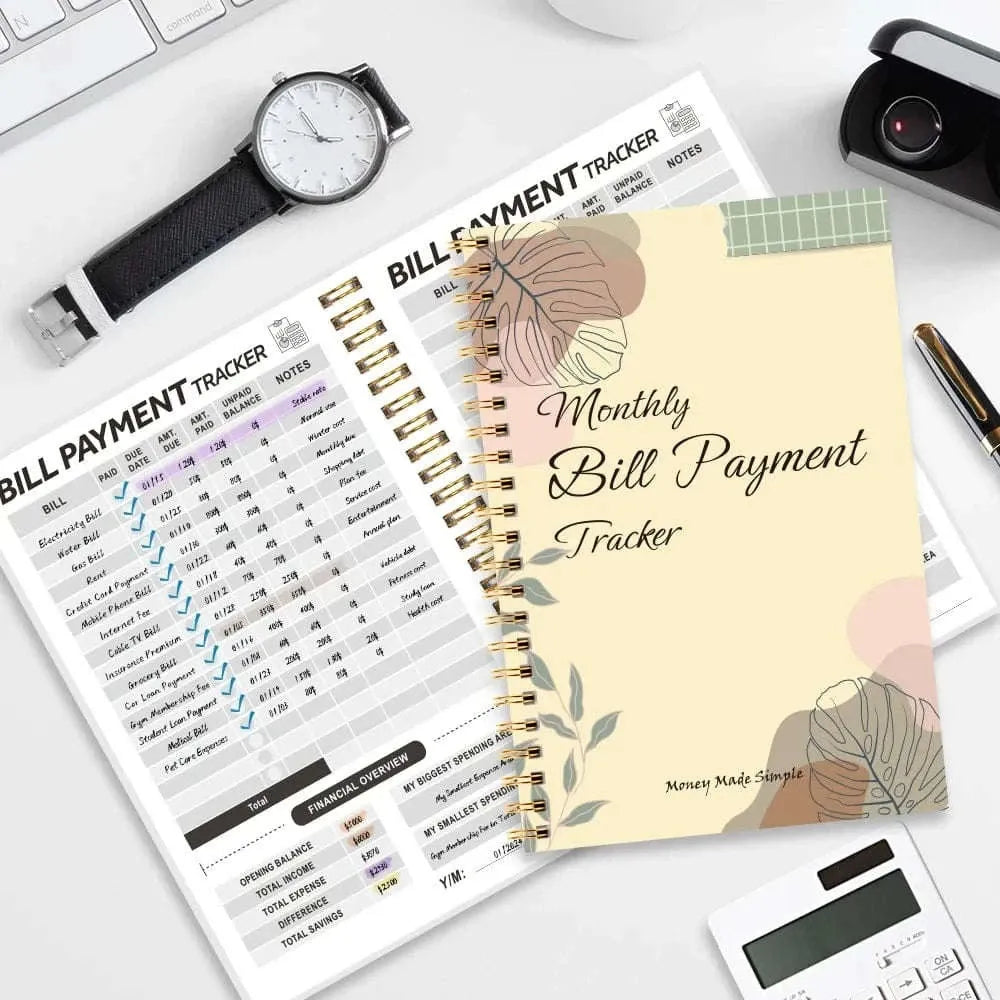 Spiral-bound bill payment tracker notebook with open monthly expense tables