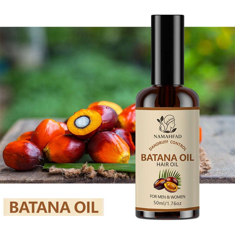 Person applying Namahfad Batana Hair Oil onto their scalp with fingertips.  
